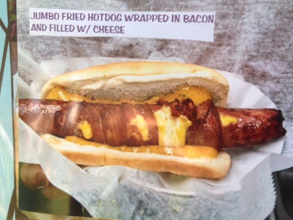 What? A hot dog wrapped in bacon and stuffed with cheese, and all of it is fried. I don't know if I should eat it or use it to oil the hinges in my house.  Cholesterol crazy...but also sounds kinda good.
